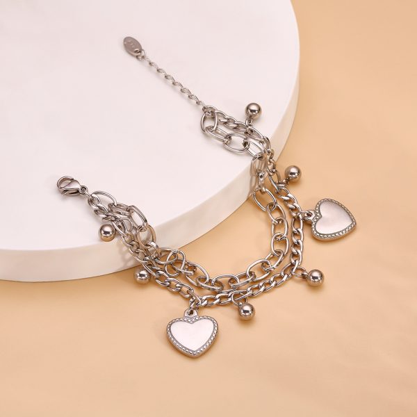 O1CN018RMypS25wjPbxMMg5_3529117591-0-cib.jpg Stainless Steel Heart Charm Bracelet 738921514136