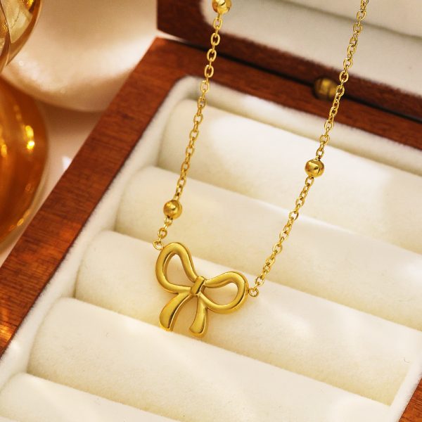 O1CN01E1bCAu25wjVDmuFjA_3529117591-0-cib.jpg Stainless Steel Bow Necklace 809793137298