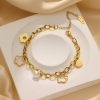O1CN01L4quNK25wjUigbArg_3529117591-0-cib.jpg Stainless Steel Pearl Flower Bracelet 798767193233