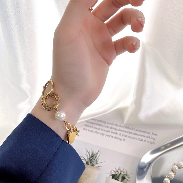 O1CN01n0bN7V25wjbritZDV_3529117591-0-cib.jpg Stainless Steel Hollow Pearl Bracelet 633231843492
