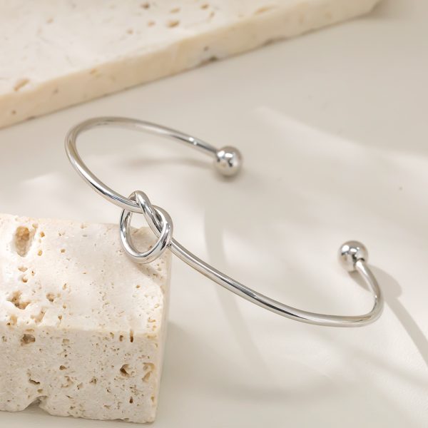 O1CN01t2tUFz25wjbcw7B22_3529117591-0-cib.jpg Stainless Steel Knot Open Bangle 948808921290